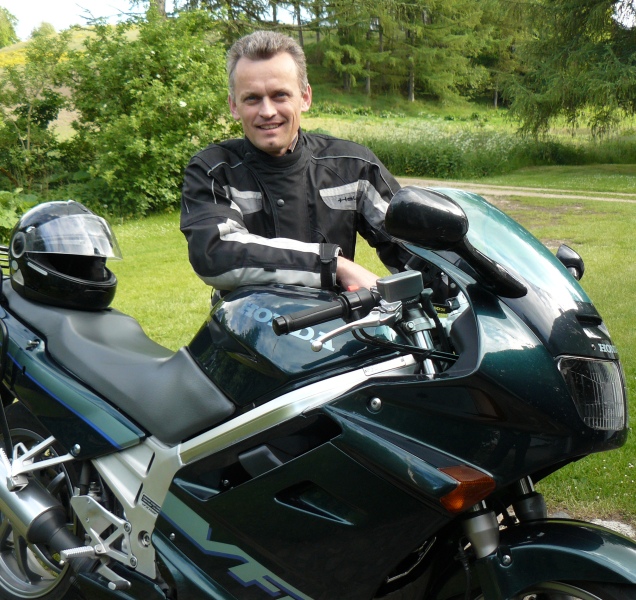 Tourstart founder Jan Agnoletti Pedersen with Honda VFR 750 motorcycle Tourstart founder Jan Agnoletti Pedersen with Honda VFR 750 motorcycle